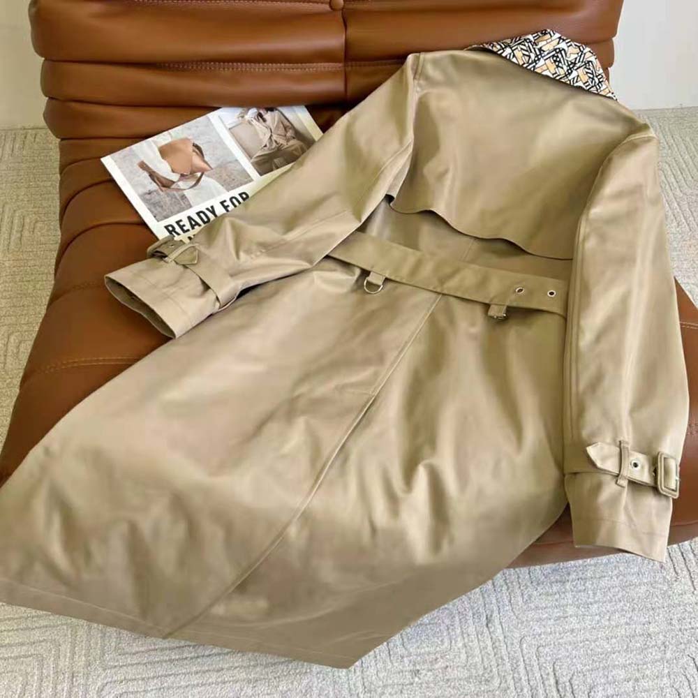 Side angle showing silhouette and length of Burberry Women Monogram Print Detail Cotton Gabardine Trench Coat