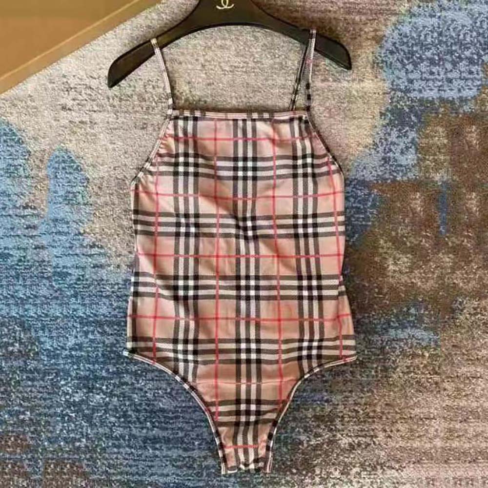 Close-up of beige fabric and vintage check detail on Burberry swimsuit