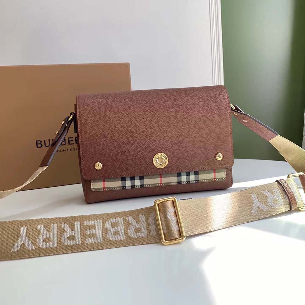 Close-up of vintage check fabric and leather on Burberry crossbody bag