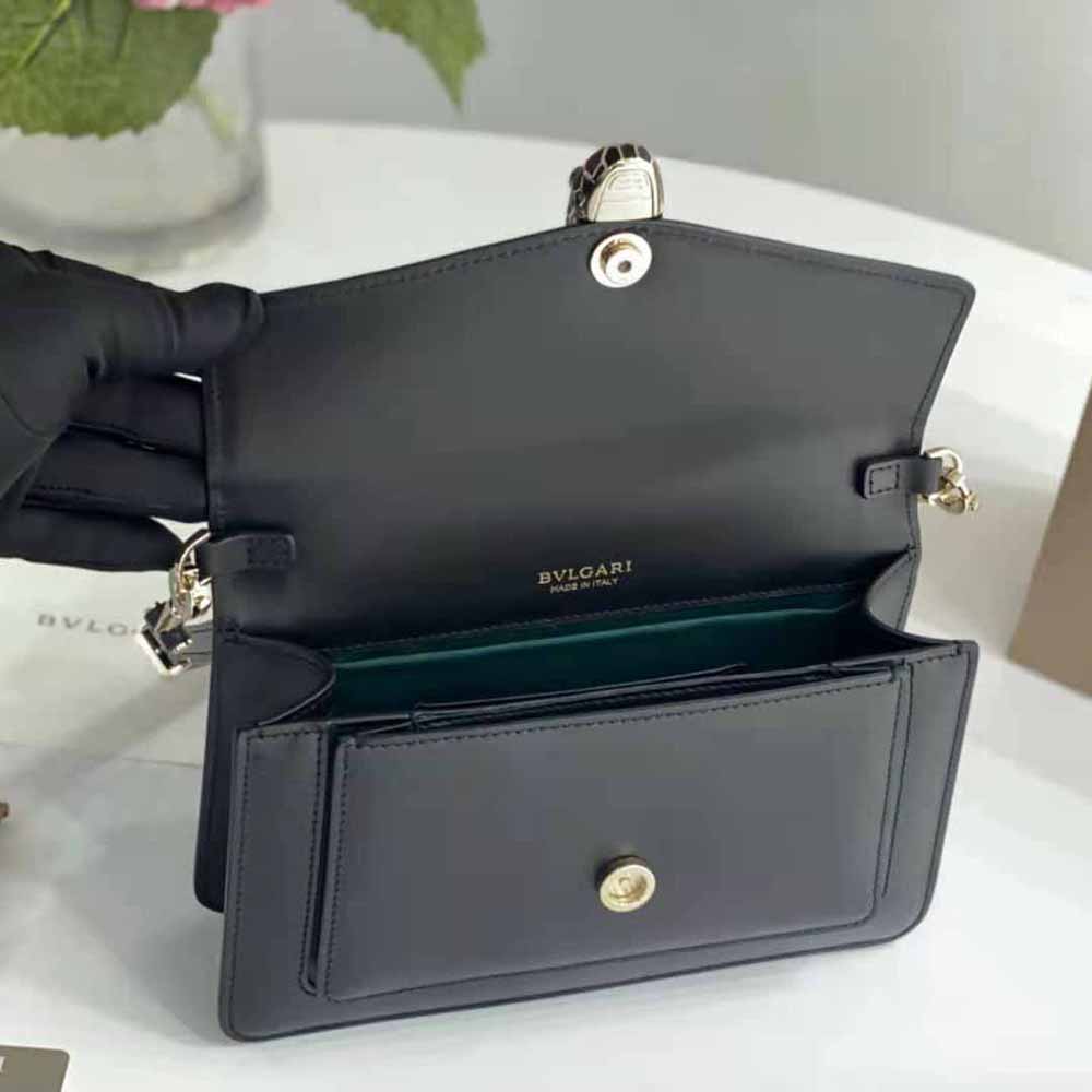 Side angle showing black leather and gold hardware on Bvlgari bag
