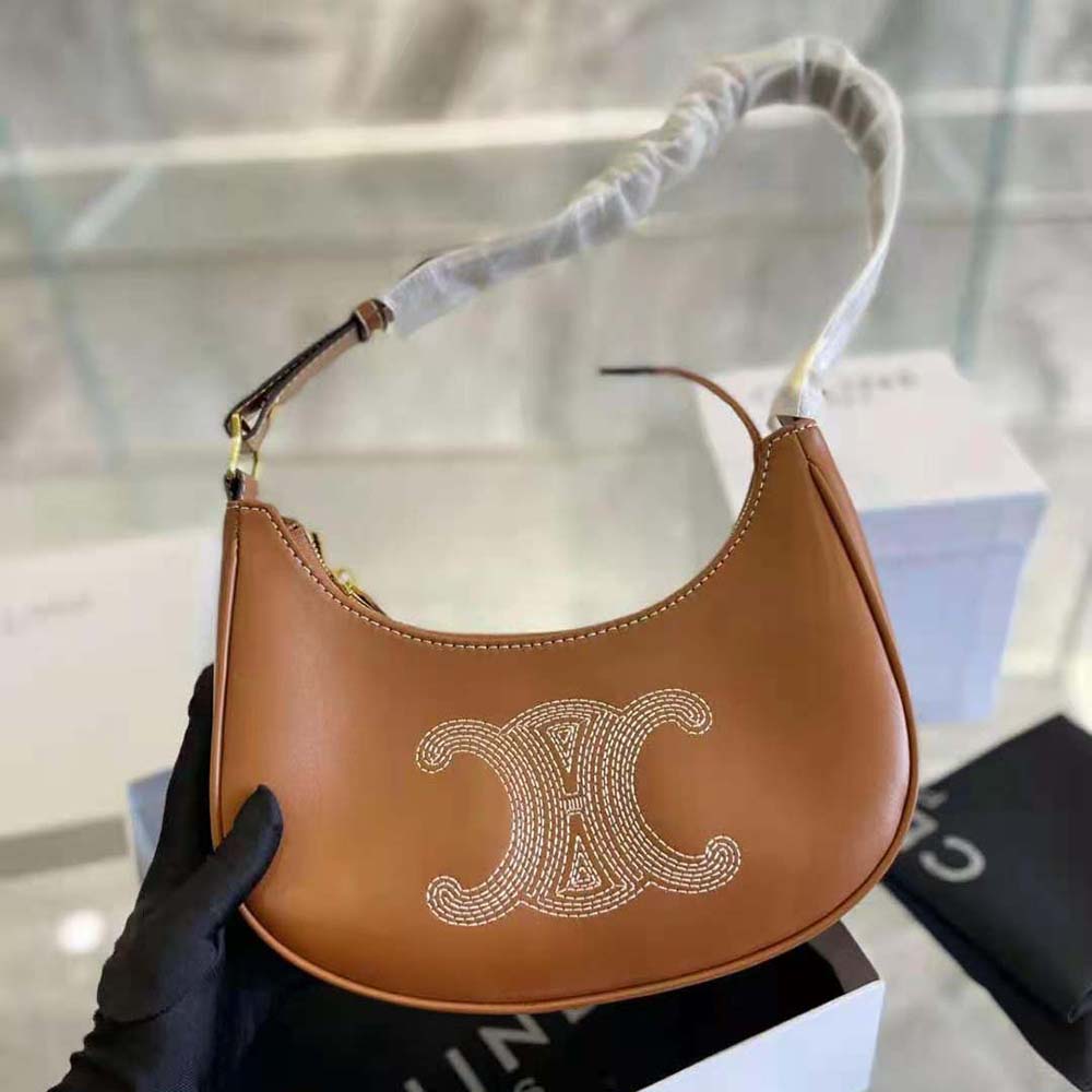 Side angle displaying structured silhouette of Celine Women Ava Bag