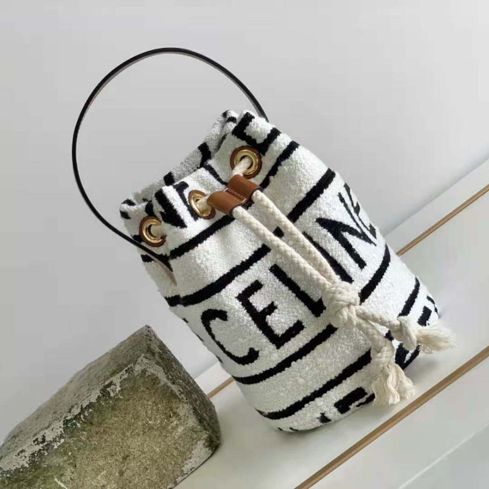 Close-up of white calfskin trim and gold hardware on Celine Women Teen Drawstring