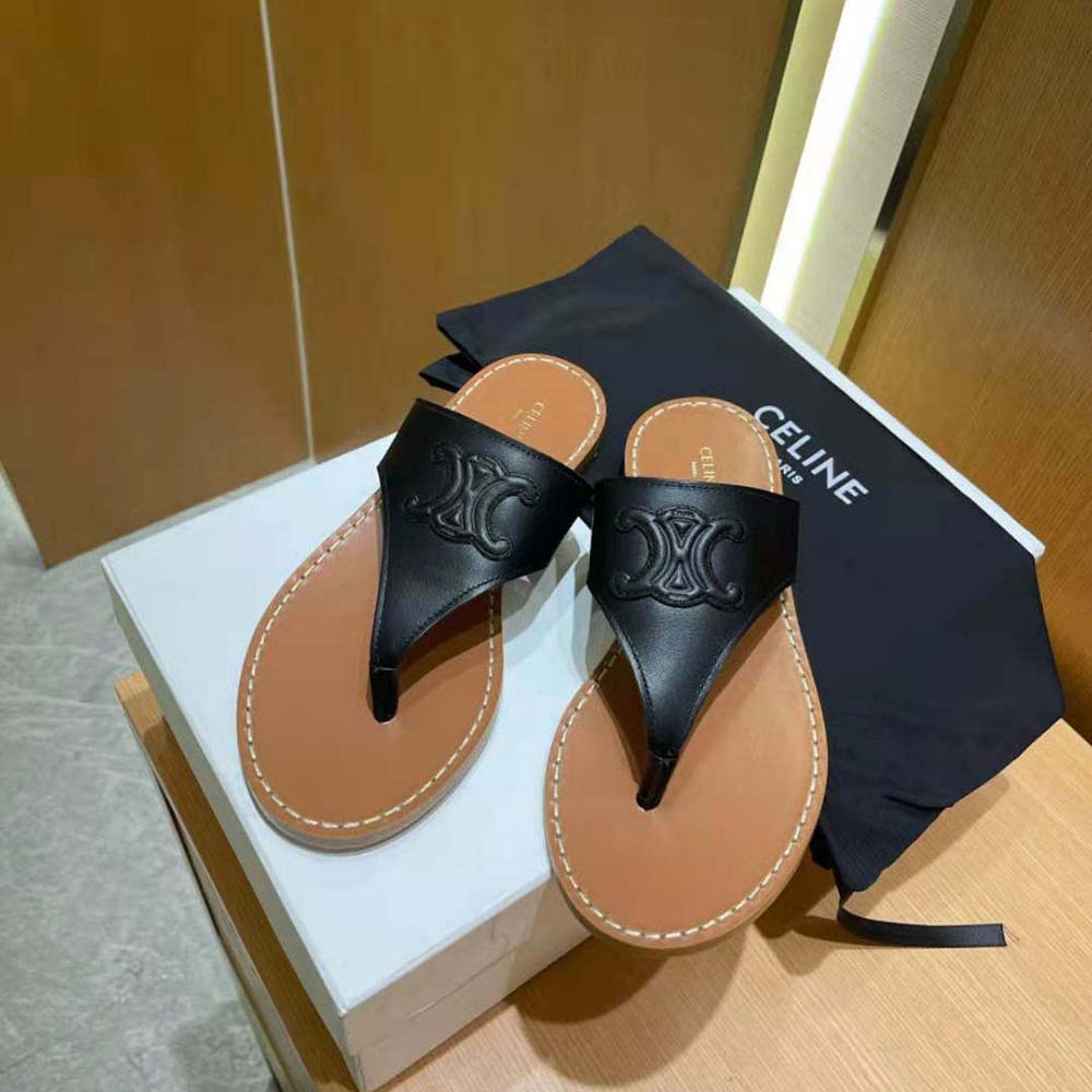 Side profile showing flat silhouette of Celine Triomphe Flat Thong sandal