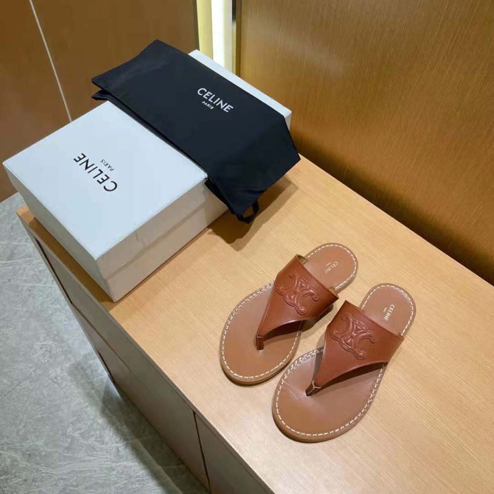 Close-up of gold-tone Triomphe logo hardware on Celine sandal