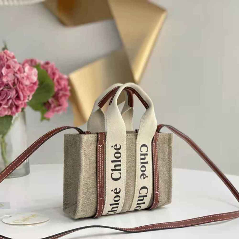 Side view of Chloe Women Mini Woody Tote Bag-Brown highlighting compact silhouette