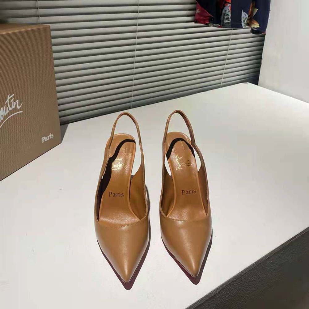 Close-up of brown leather and signature red sole on Hot Chick Sling heel