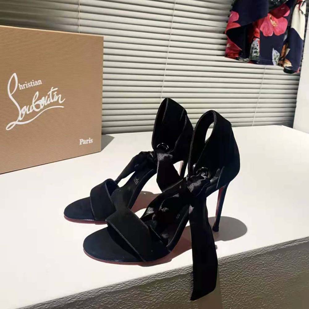 View of signature red sole on Christian Louboutin Women Torrida 100 mm Heel