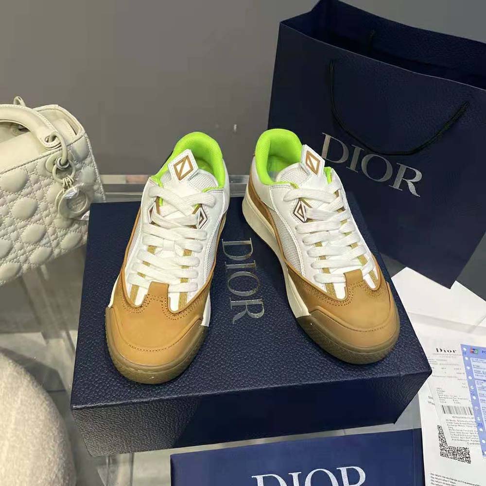 Close-up of Cactus Jack Dior emblem on brown sneaker