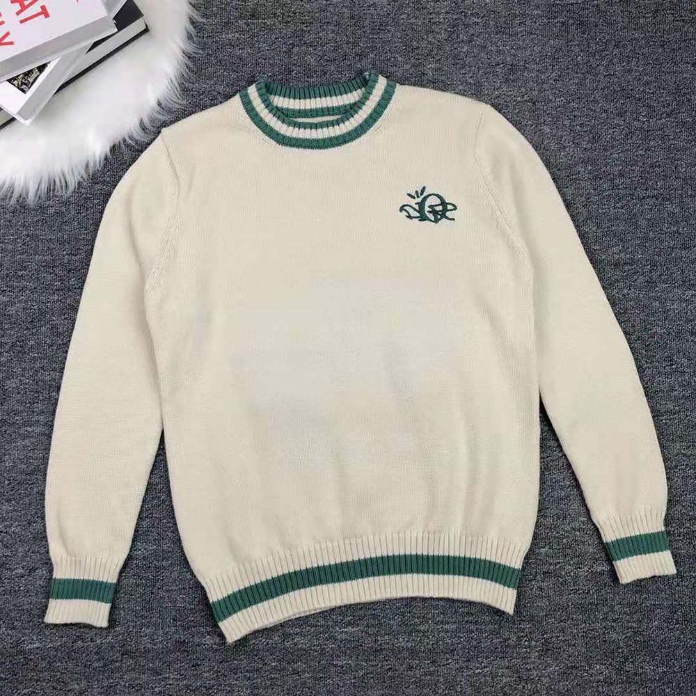 Close-up of cashmere texture and Cactus Jack logo detail on sweater