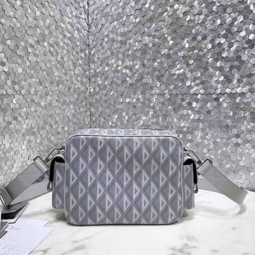 Side angle showing smooth calfskin and adjustable strap of Dior Men Hit the Road Messenger Bag