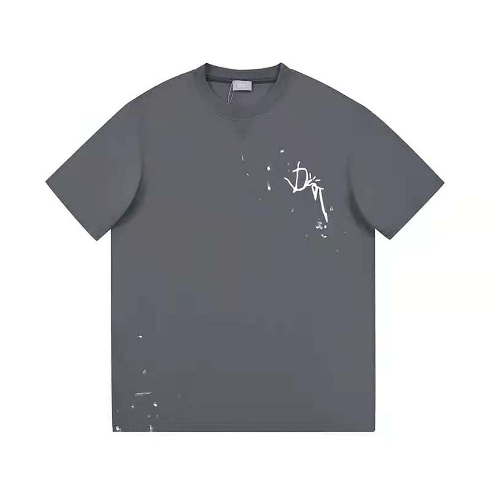 Close-up of signature Cactus Jack graphic on gray Dior T-shirt