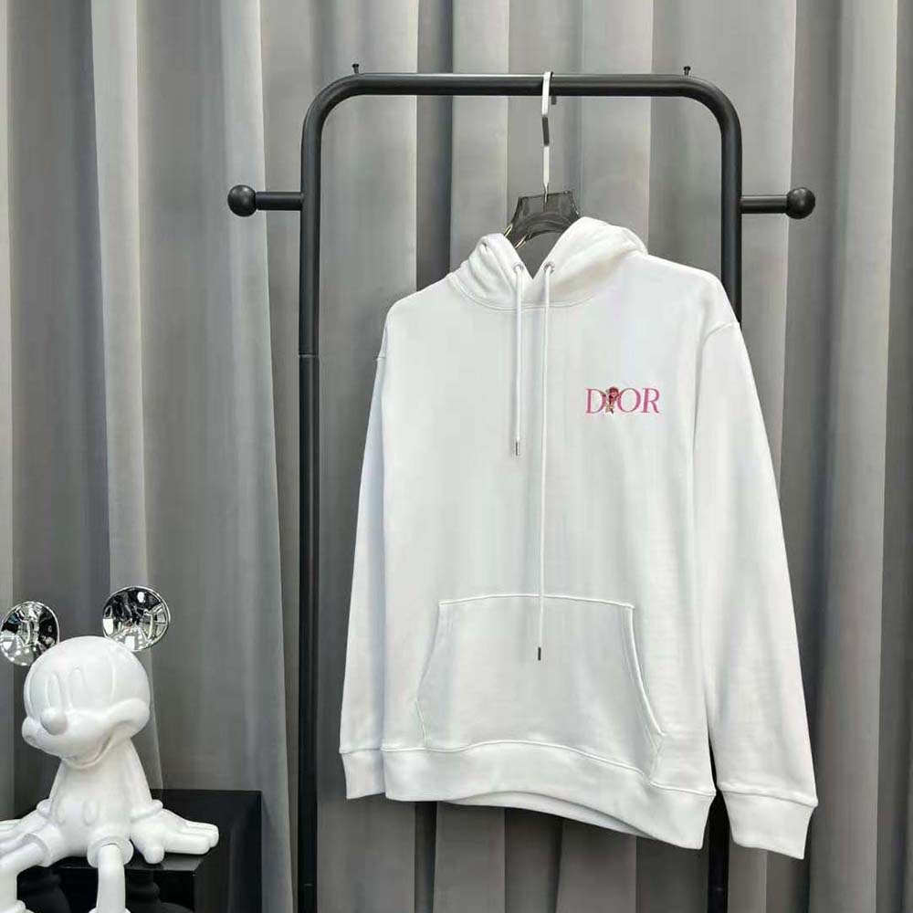Close-up of Dior Jardin embroidery on white cotton fleece hoodie