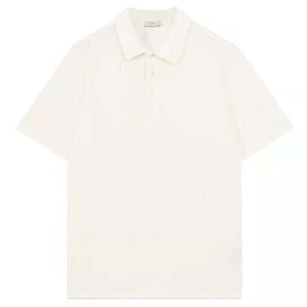 Close-up detail of Dior Oblique jacquard pattern on white polo shirt