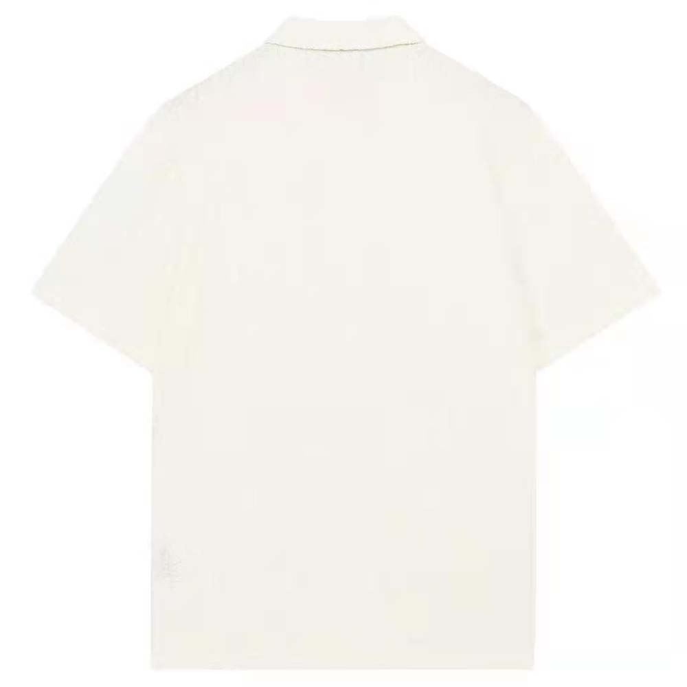 Side angle showing oversized fit of Dior Men Oversized Dior Oblique Polo Shirt