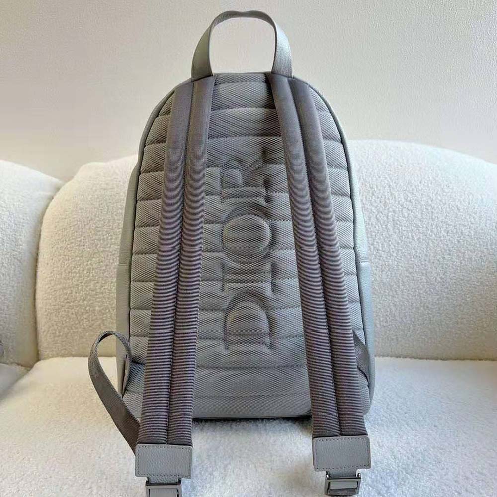 Side angle showing structured silhouette of Dior Men Rider Backpack Dior Gray