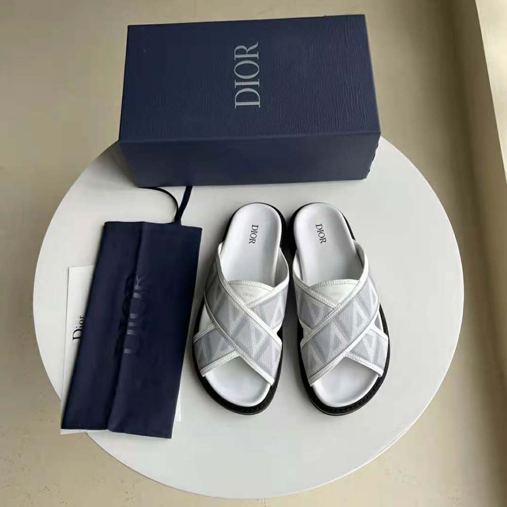 Close-up of silver CD hardware on Dior Men Aqua Sandal Dior Gray