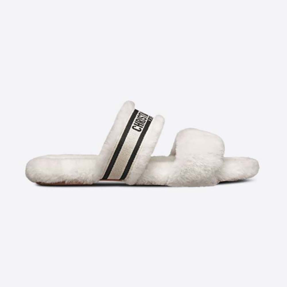 Side view of Dior Women Chez Moi Slide Black Embroidered Cotton and White Shearling