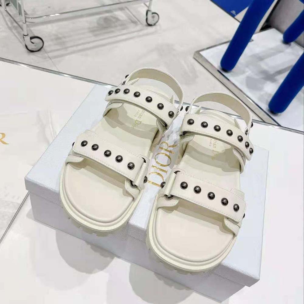 Close-up detail of silver rivets on Dior Women Dioract Sandal white leather