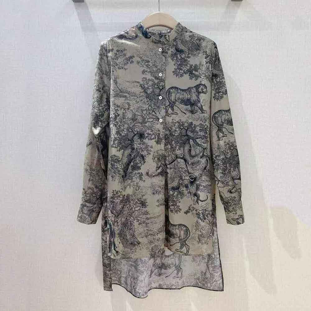Close-up detail of button and Toile De Jouy print on Dior women's blouse