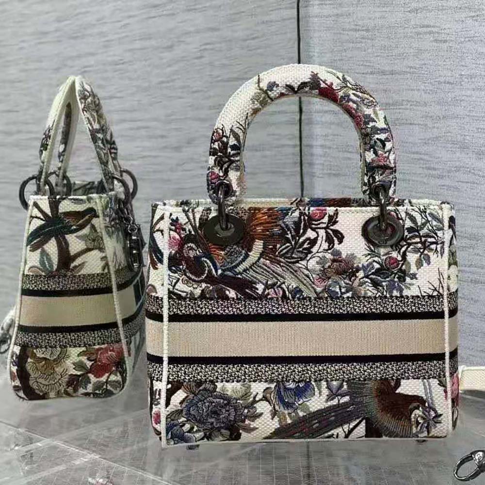 Side angle showing silver hardware and structured silhouette of Dior Lady D-lite