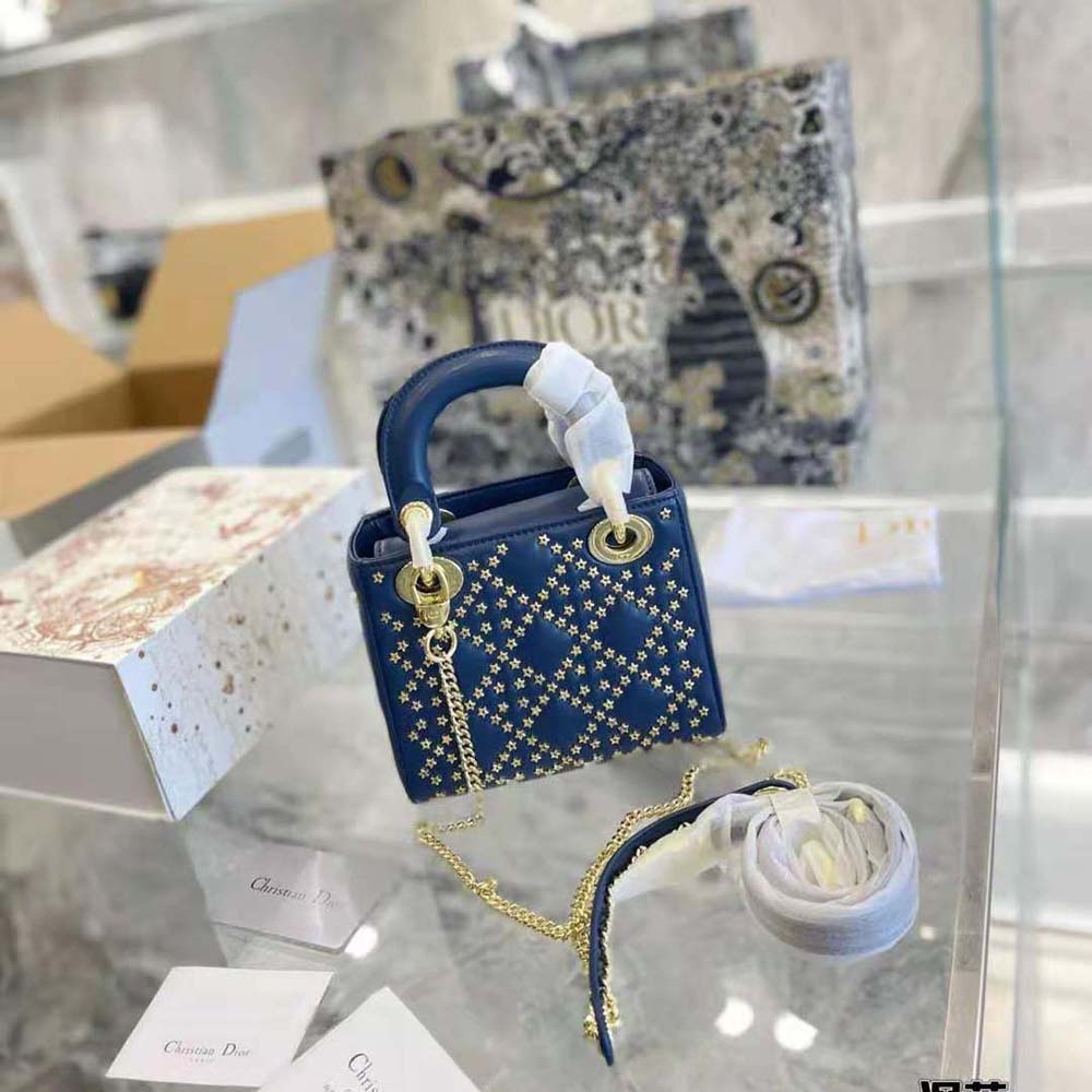 Side angle showing silver-tone hardware on Dior Women Mini Lady Dior Bag Denim Blue