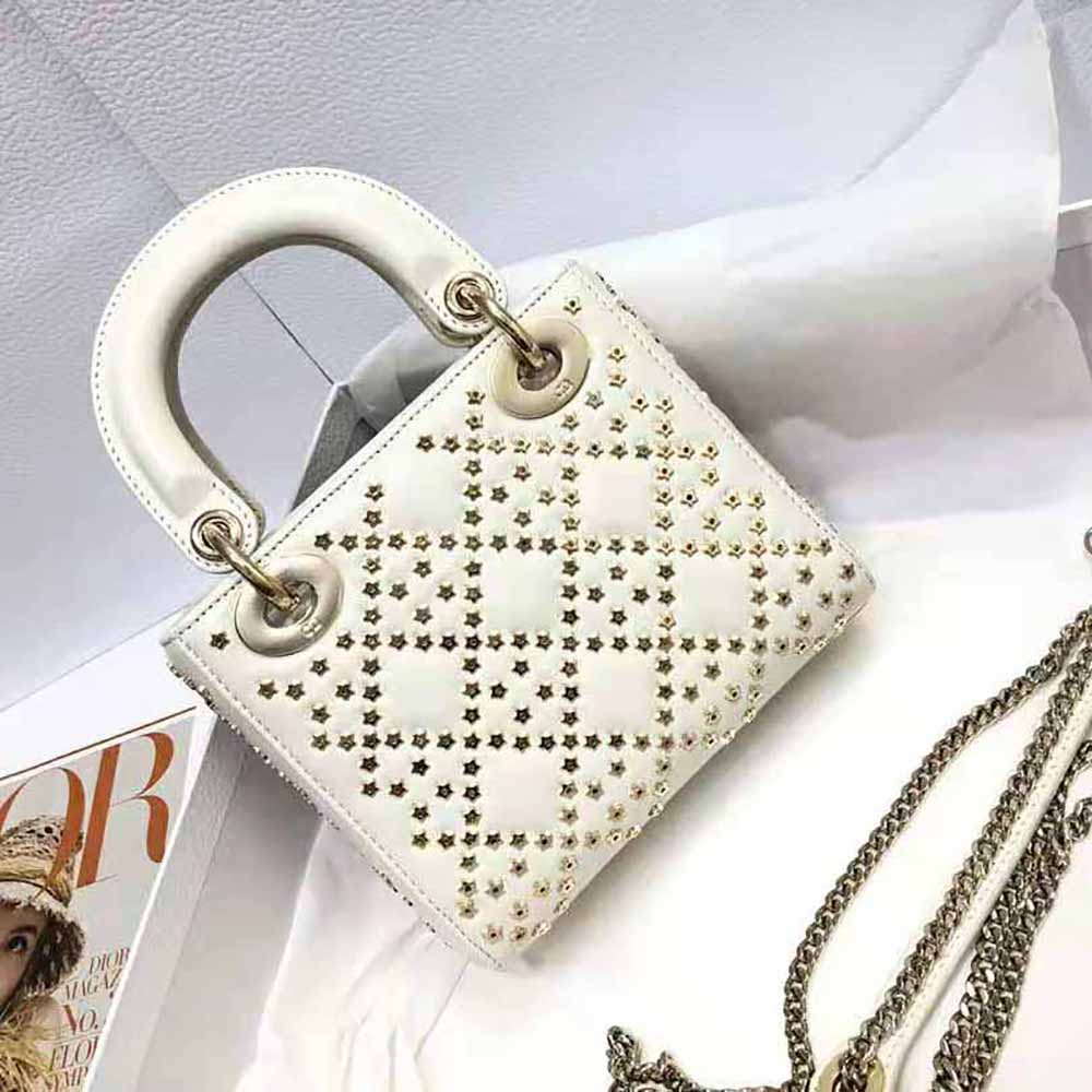 Side angle showing Cannage quilting and flap closure on Mini Lady Dior bag