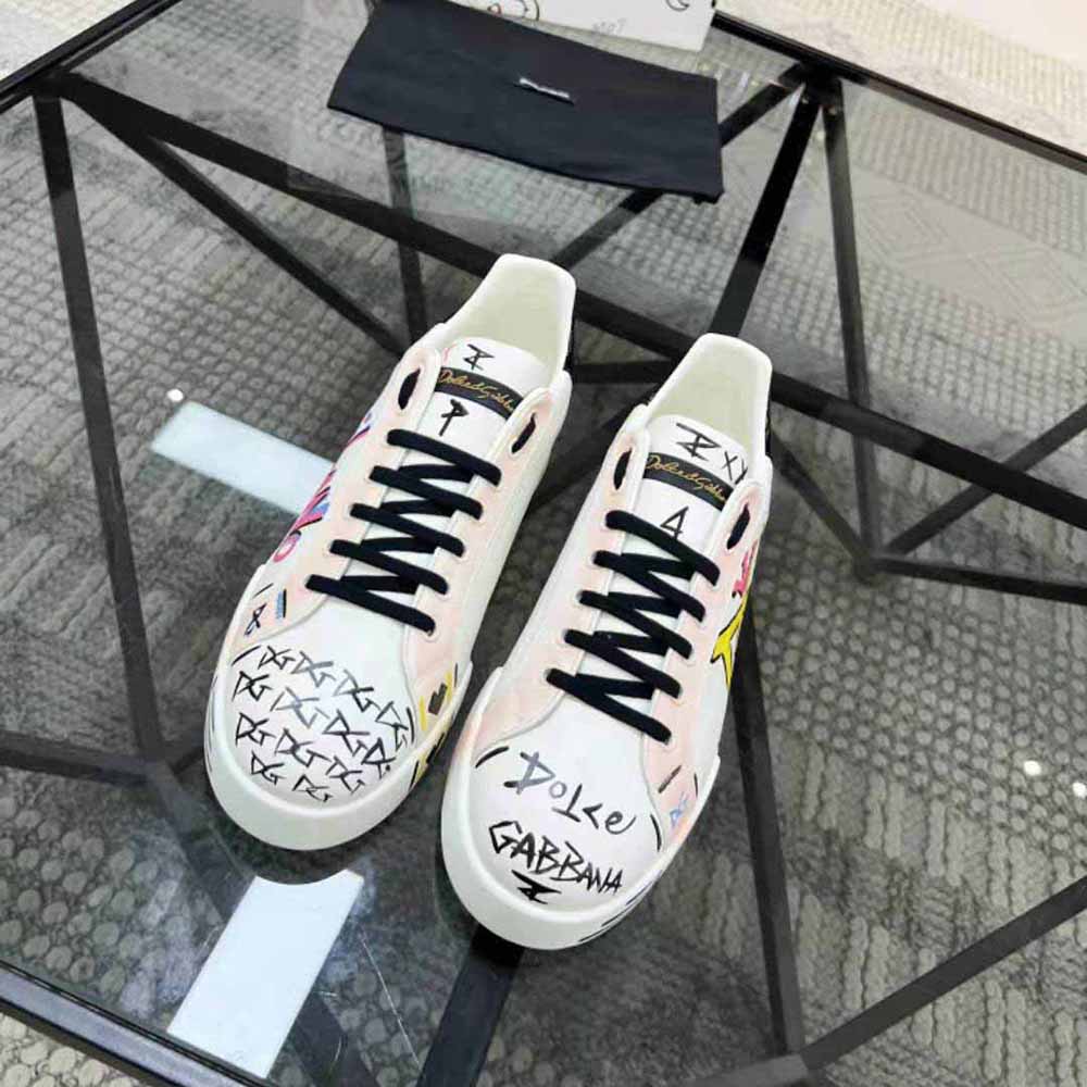 Close-up on pink leather and D&G logo hardware on Portofino Sneakers
