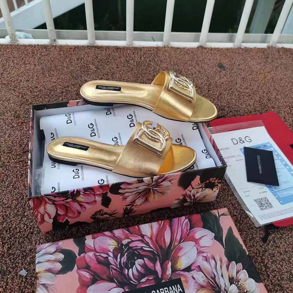 Close-up of embossed DG logo hardware on Dolce Gabbana D&G slides