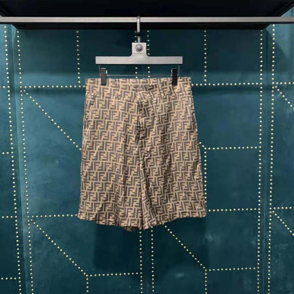 Close-up of brown fabric and Fendi logo hardware on bermudas
