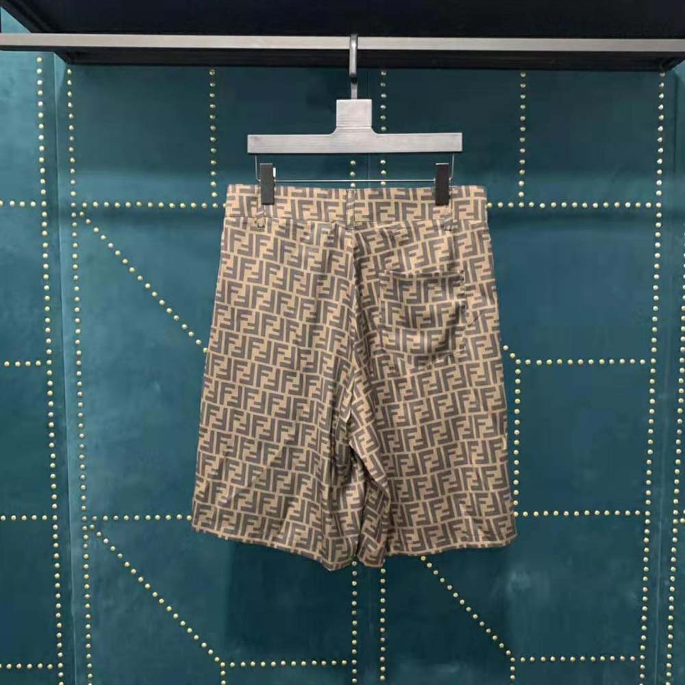 Side angle highlighting silhouette of Fendi Men Bermudas Brown Fabric Pants