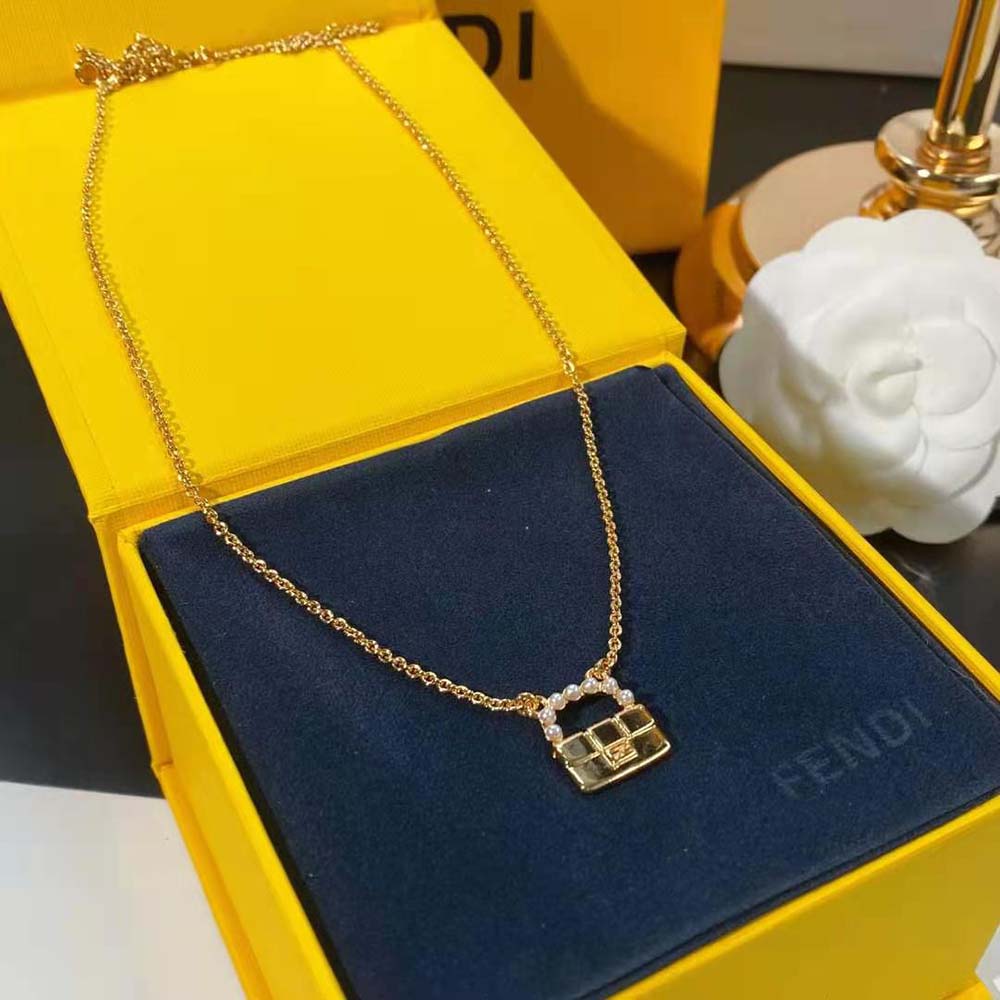 Styled shot of Fendi Women Baguette Necklace Gold-Colored on model’s neck