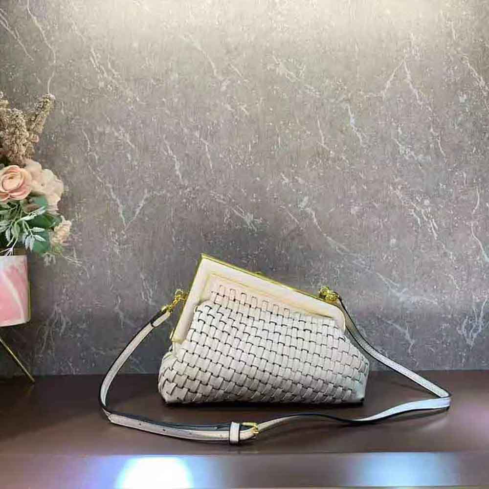 Side angle showing gold hardware on Fendi Women Fendi First Small Beige Bag