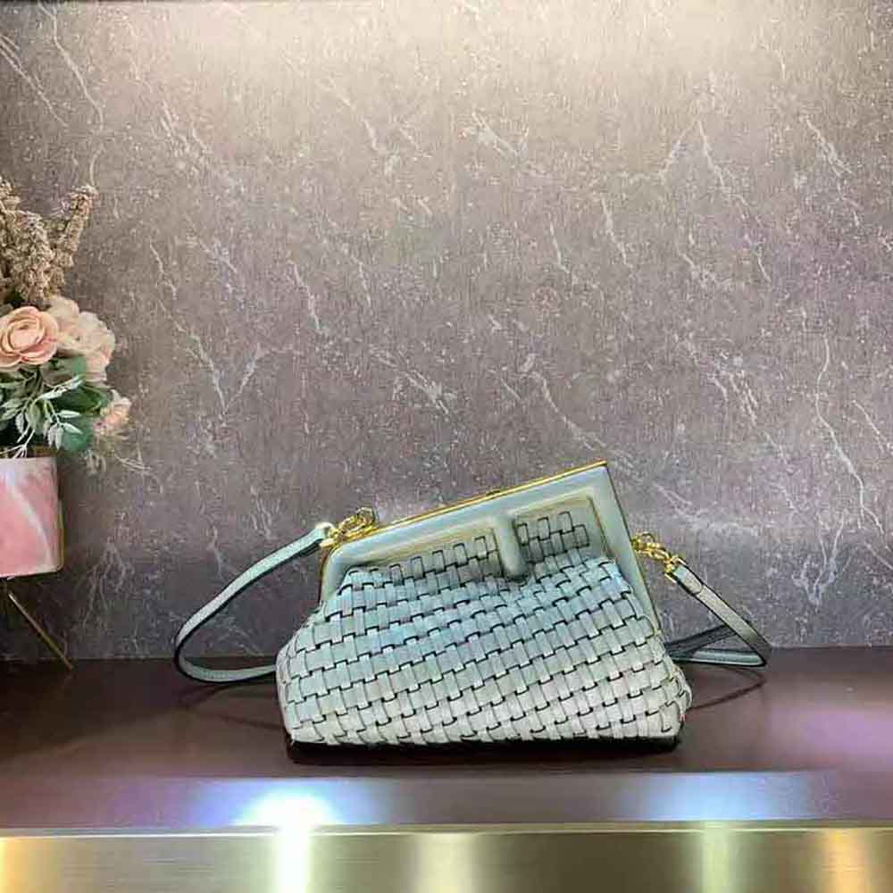 Close-up of gold-tone interlace hardware on Fendi Women Fendi First Small Mint Green Bag