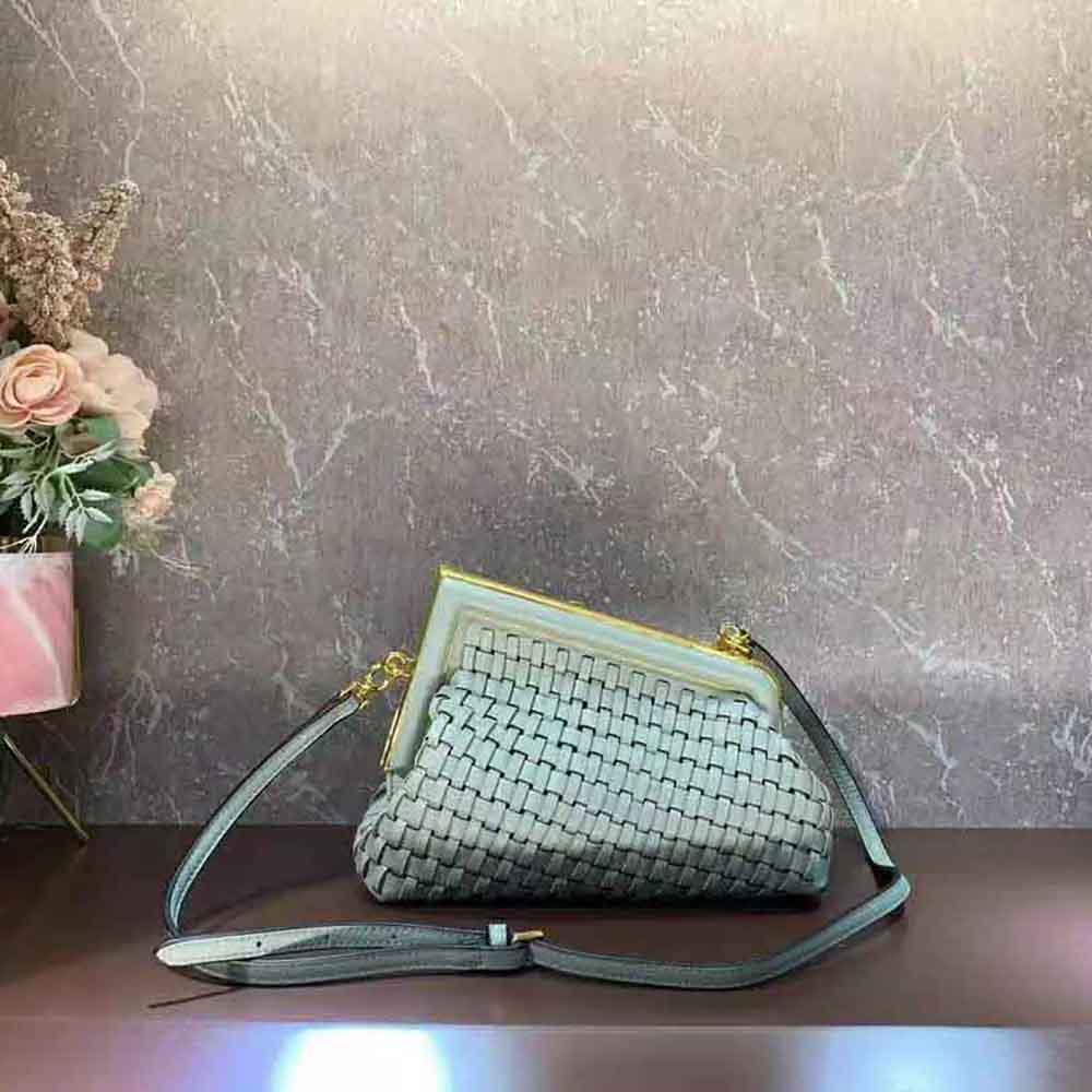 Side profile showing adjustable strap on Fendi Women Fendi First Small Mint Green Leather Bag