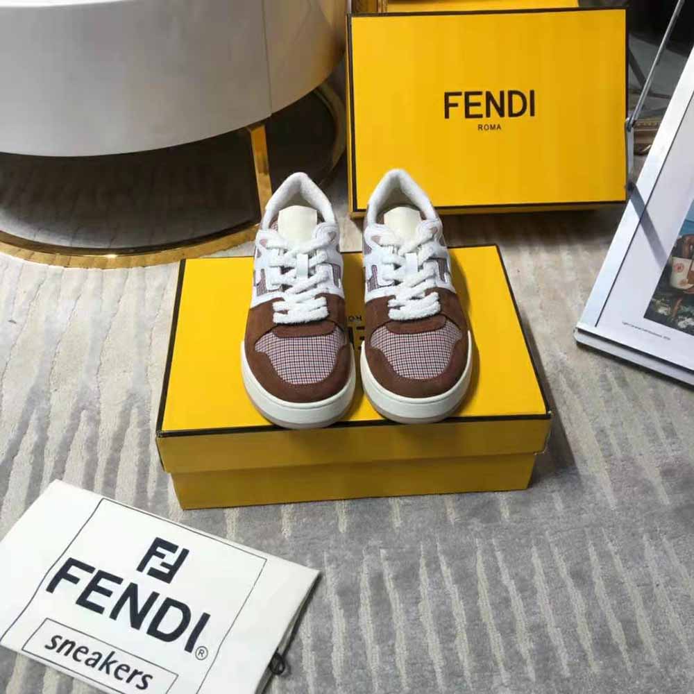 Close-up of brown suede and Fendi logo hardware on low-tops
