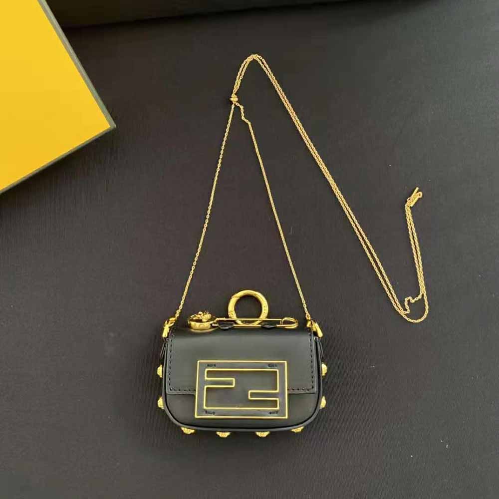 Close-up of gold-tone Fendace logo hardware on the black leather charm