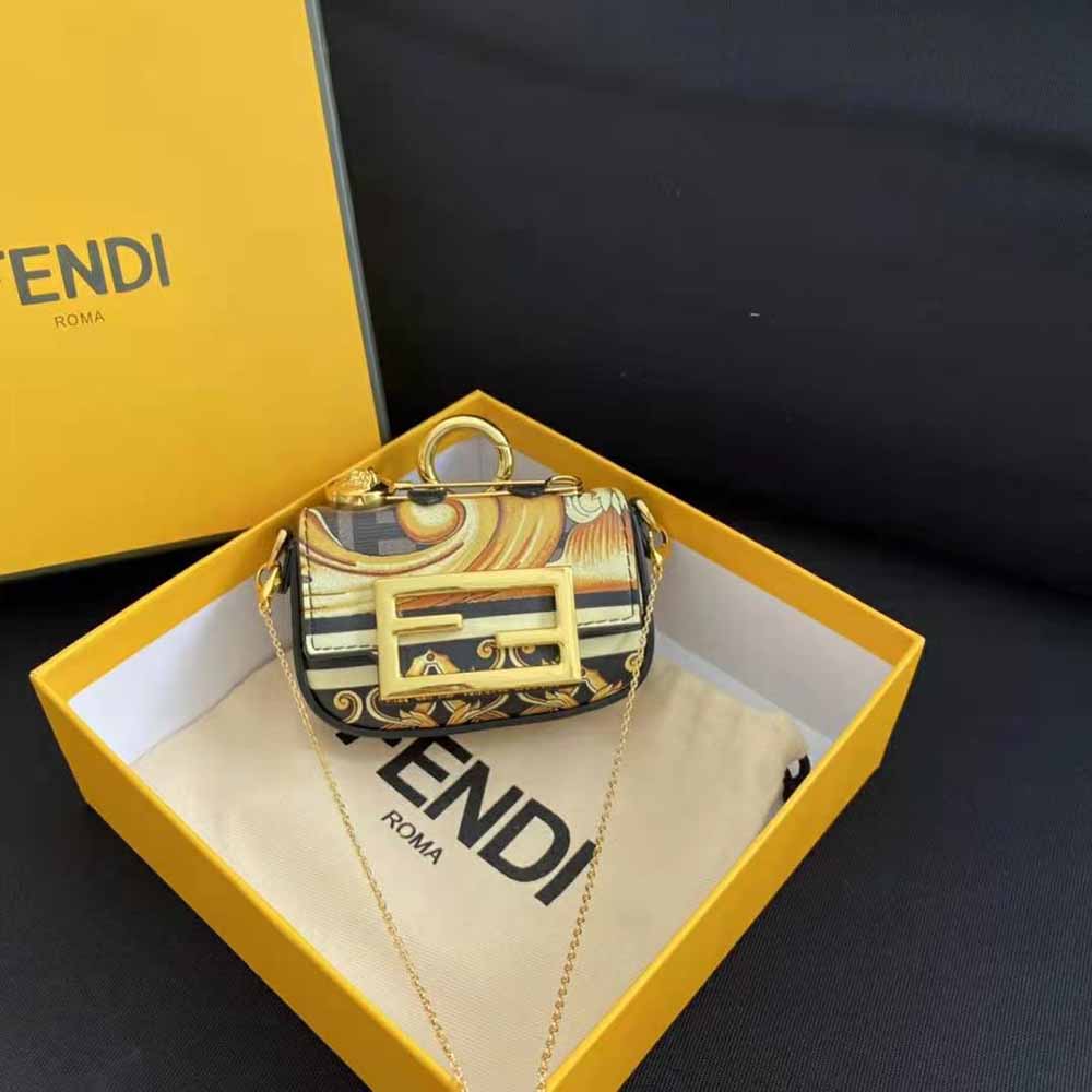 Close-up of gold-tone hardware on Fendi Women Nano Baguette Charm Fendace charm