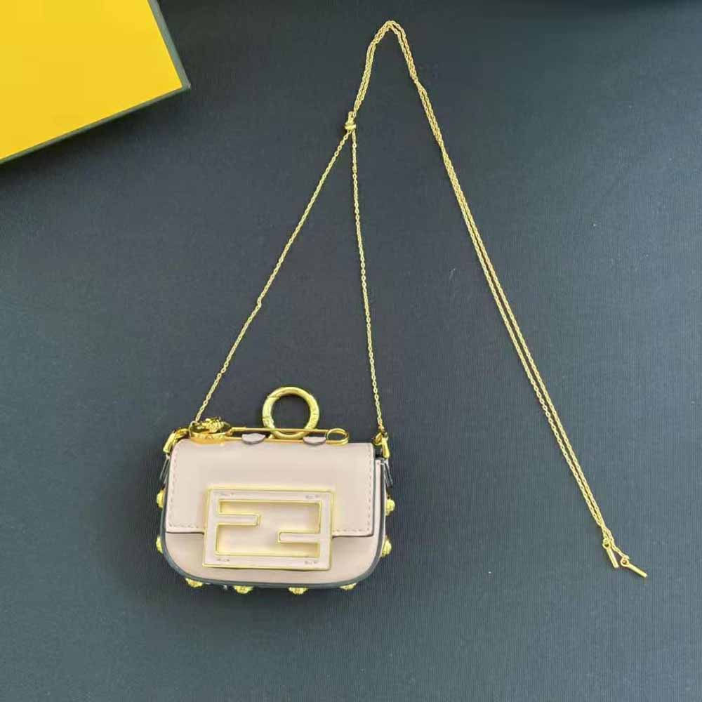 Close-up of gold-tone hardware on Fendi Women Nano Baguette Charm Fendace Pink Leather Charm