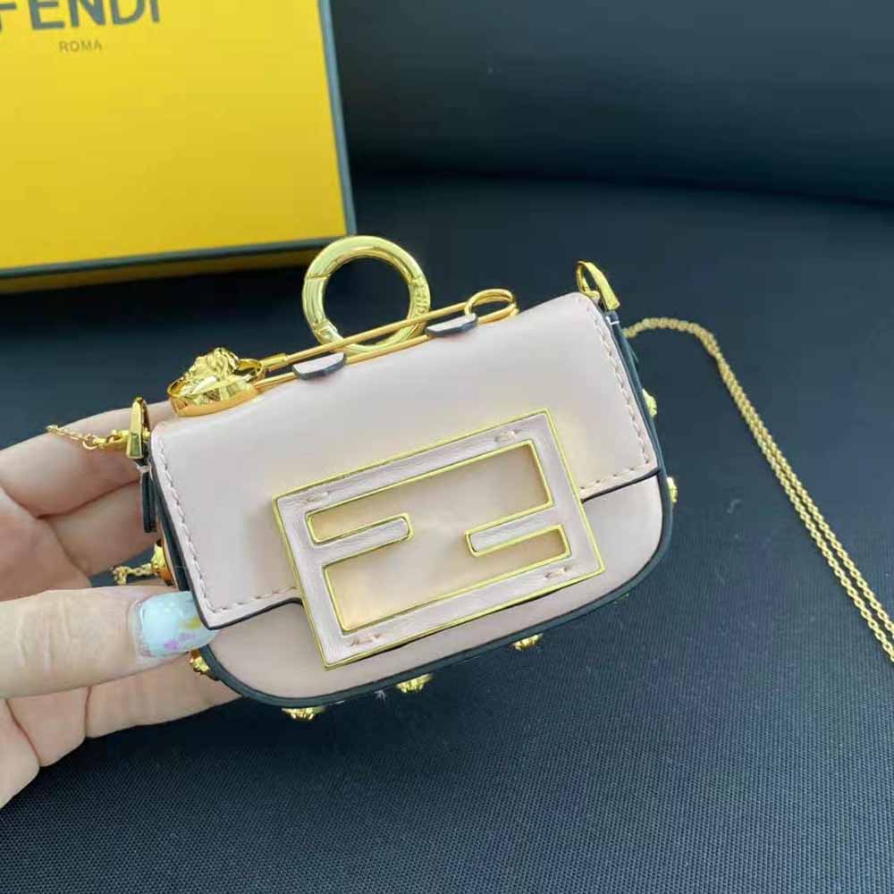 Side profile showing slim silhouette of Fendi Women Nano Baguette Charm Fendace Pink Leather Charm