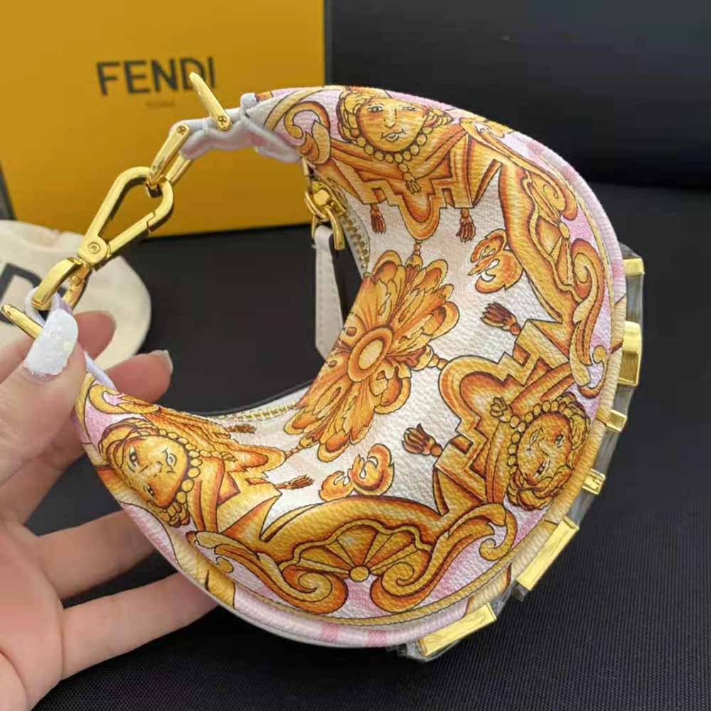 Side angle showing compact silhouette of Fendi Pink Silk Charm bag