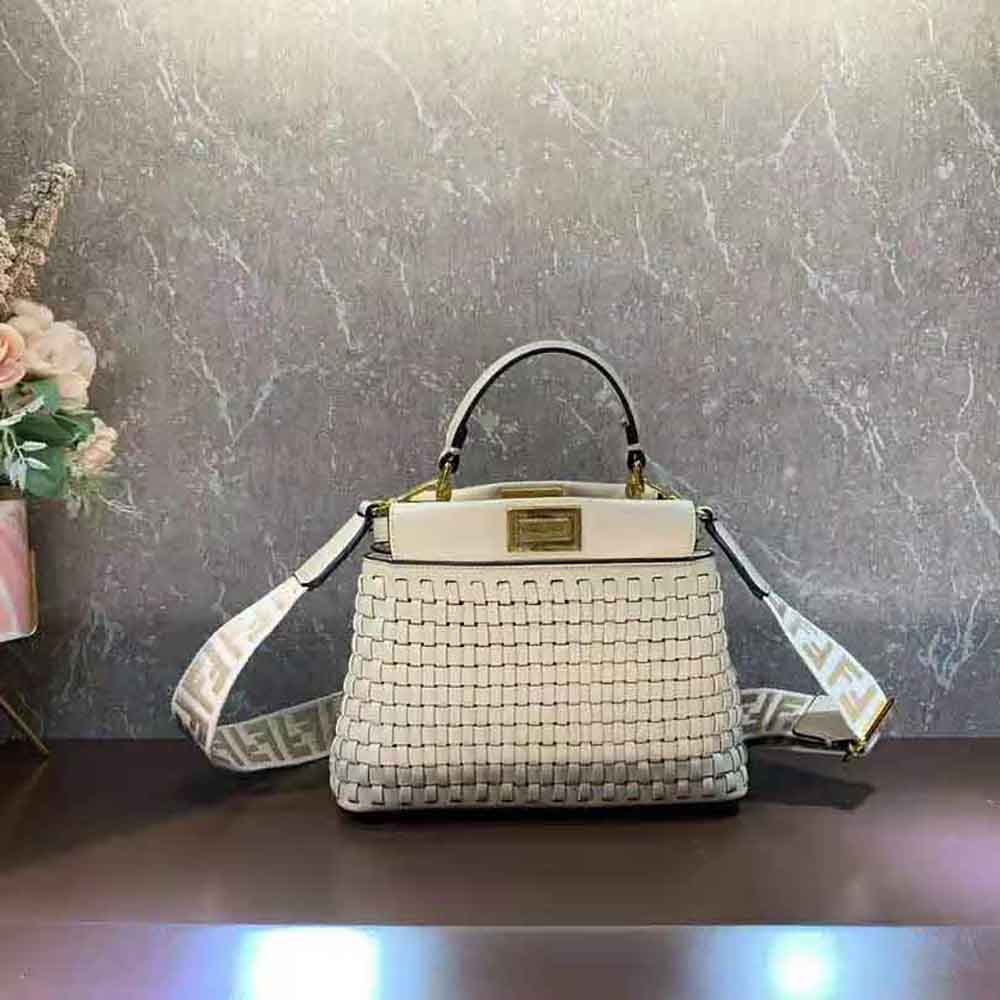 Close-up of braided leather and Fendi logo on Peekaboo Mini Beige Bag