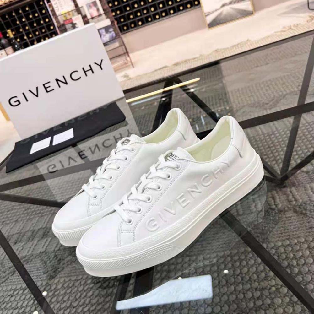 Close-up of white leather and embossed Givenchy logo on sneaker