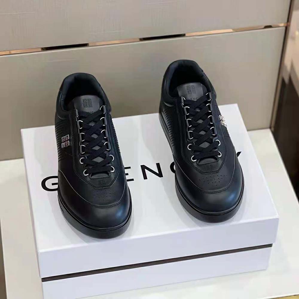 Close-up of black leather and embossed logo on Givenchy Men G4 Sneakers
