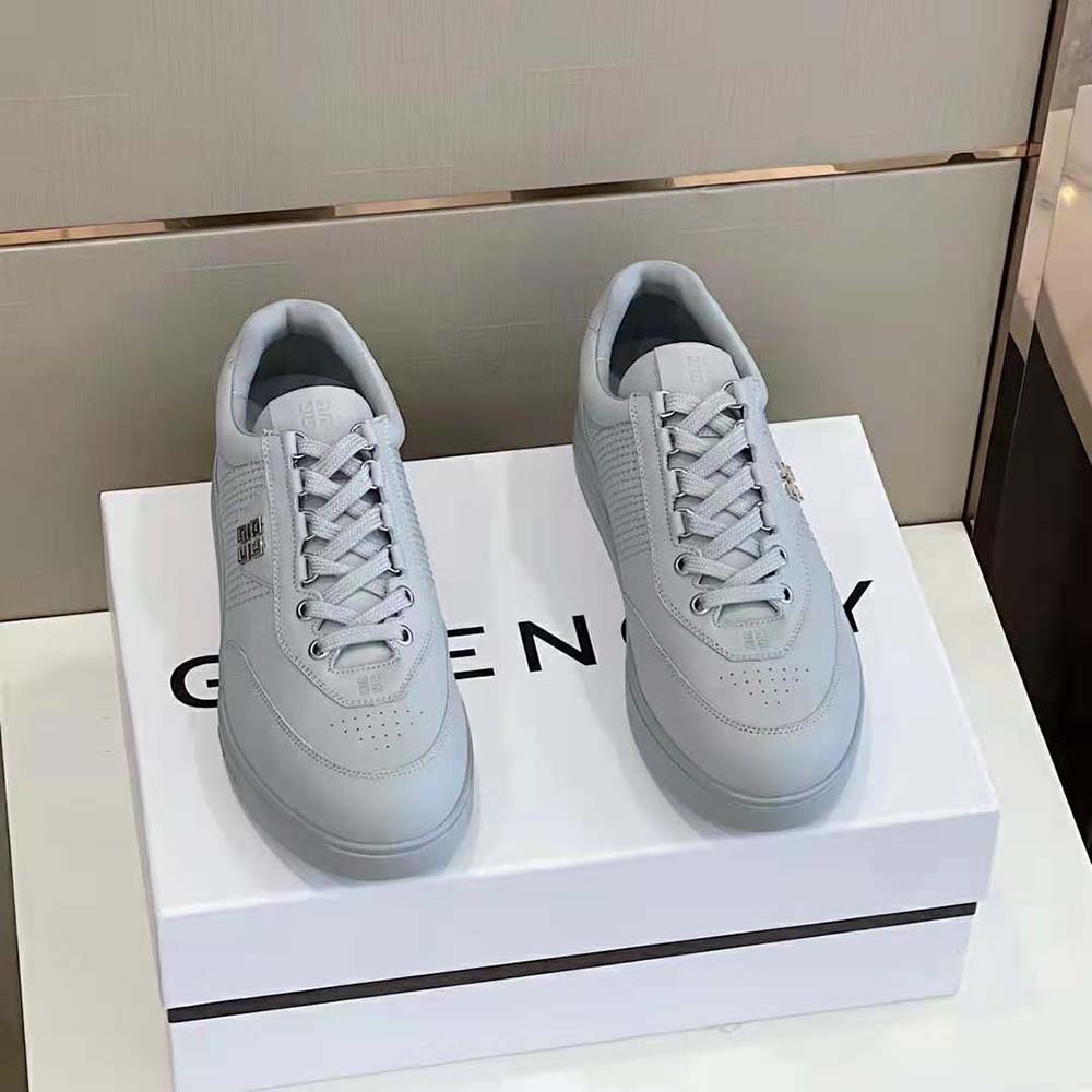 Close-up of silver leather and embossed logo on Givenchy Men G4 Sneakers