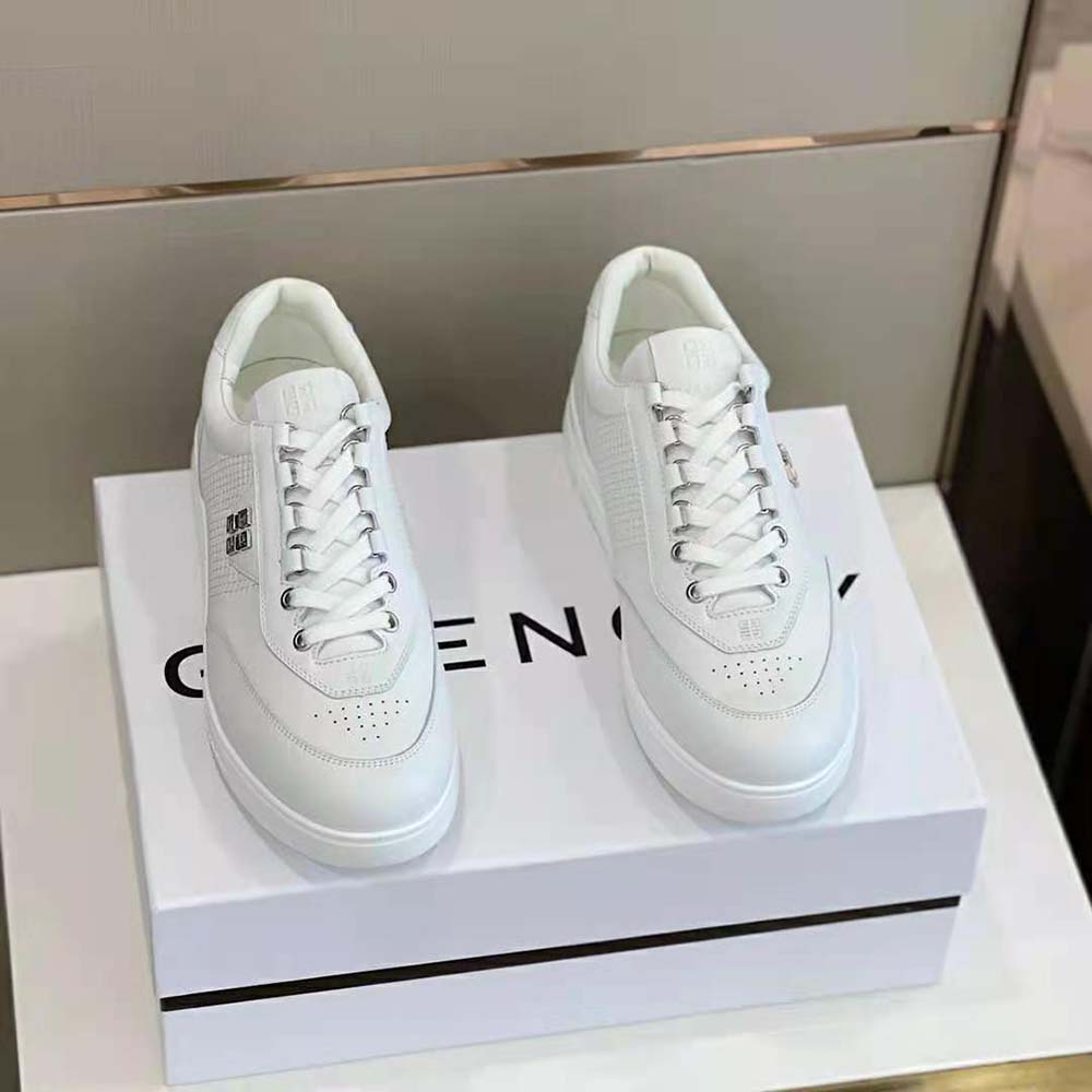 Close-up of Givenchy embossed logo on white leather G4 Sneakers
