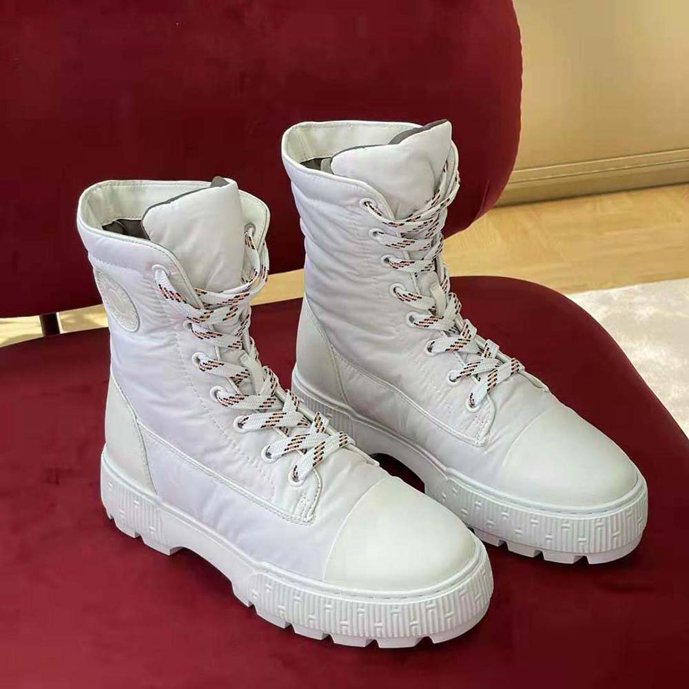 Close-up of lace-up closure and parachute fabric on Hermes ankle boot