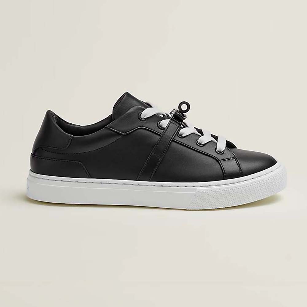 Side profile of Hermes Women Day Sneaker in Calfskin with Functional Shiny Black
