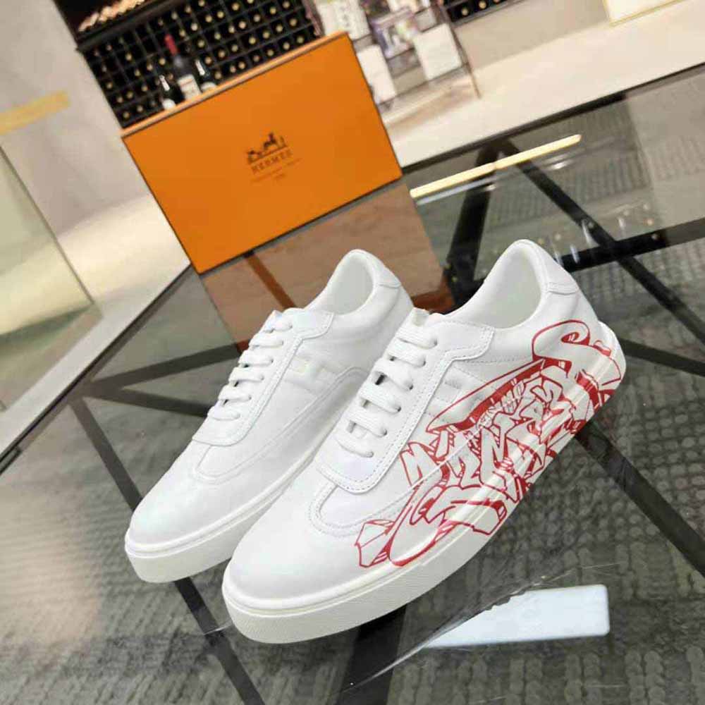 Close-up on Graff Hermes print and iconic H hardware on white sneaker