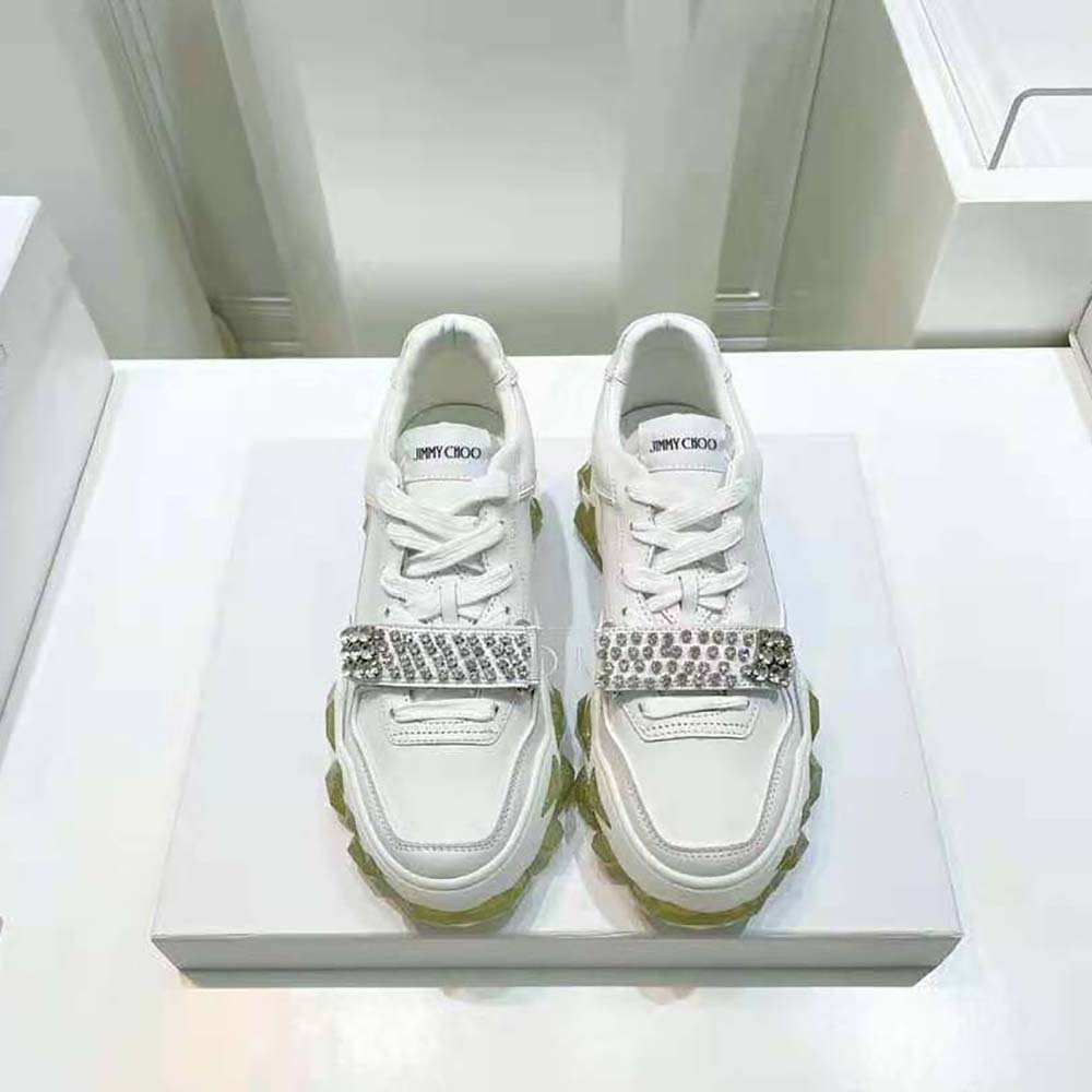 Close-up of crystal X strap on Jimmy Choo White Calf Leather Low Top Trainers