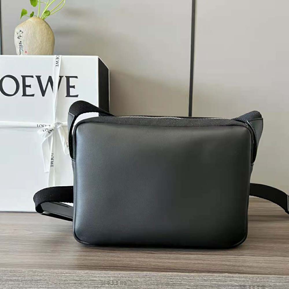 Side angle showing adjustable strap and compact silhouette of Loewe Military Messenger Bag